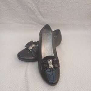 Black leather flats with diamond element